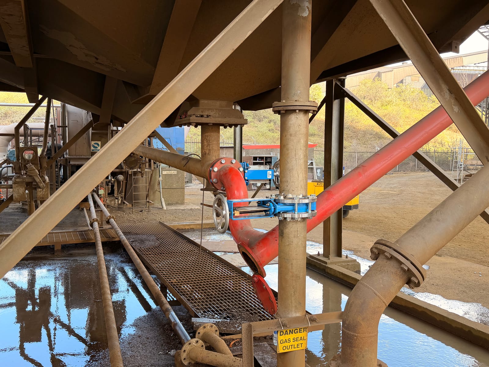 Valve fitted into the red line beneath the plant structure