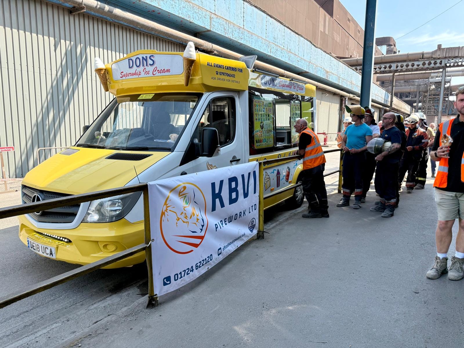 Crew being served at the ice cream van KBVI put on during the outage