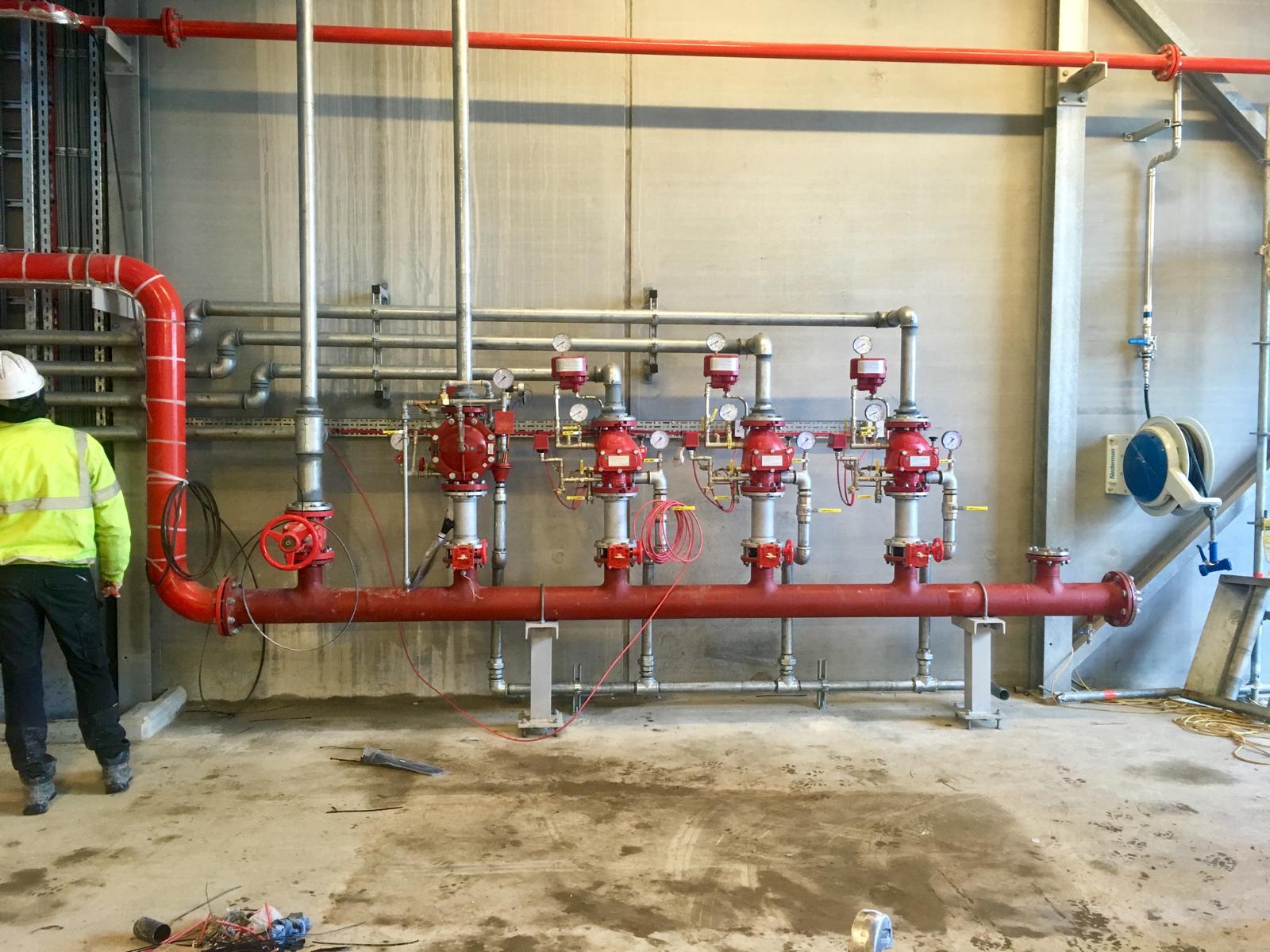 Fire main and process lines through the building