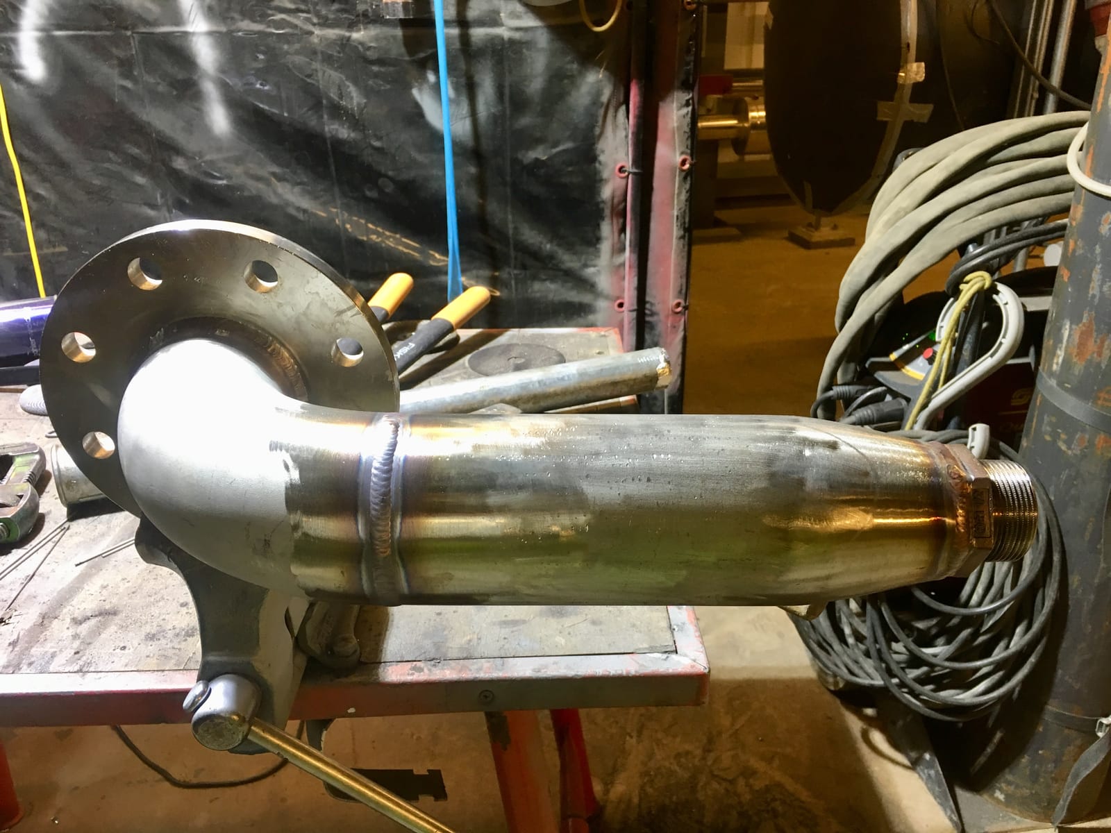 Flanged stainless spool with a branch, on the fabrication bench